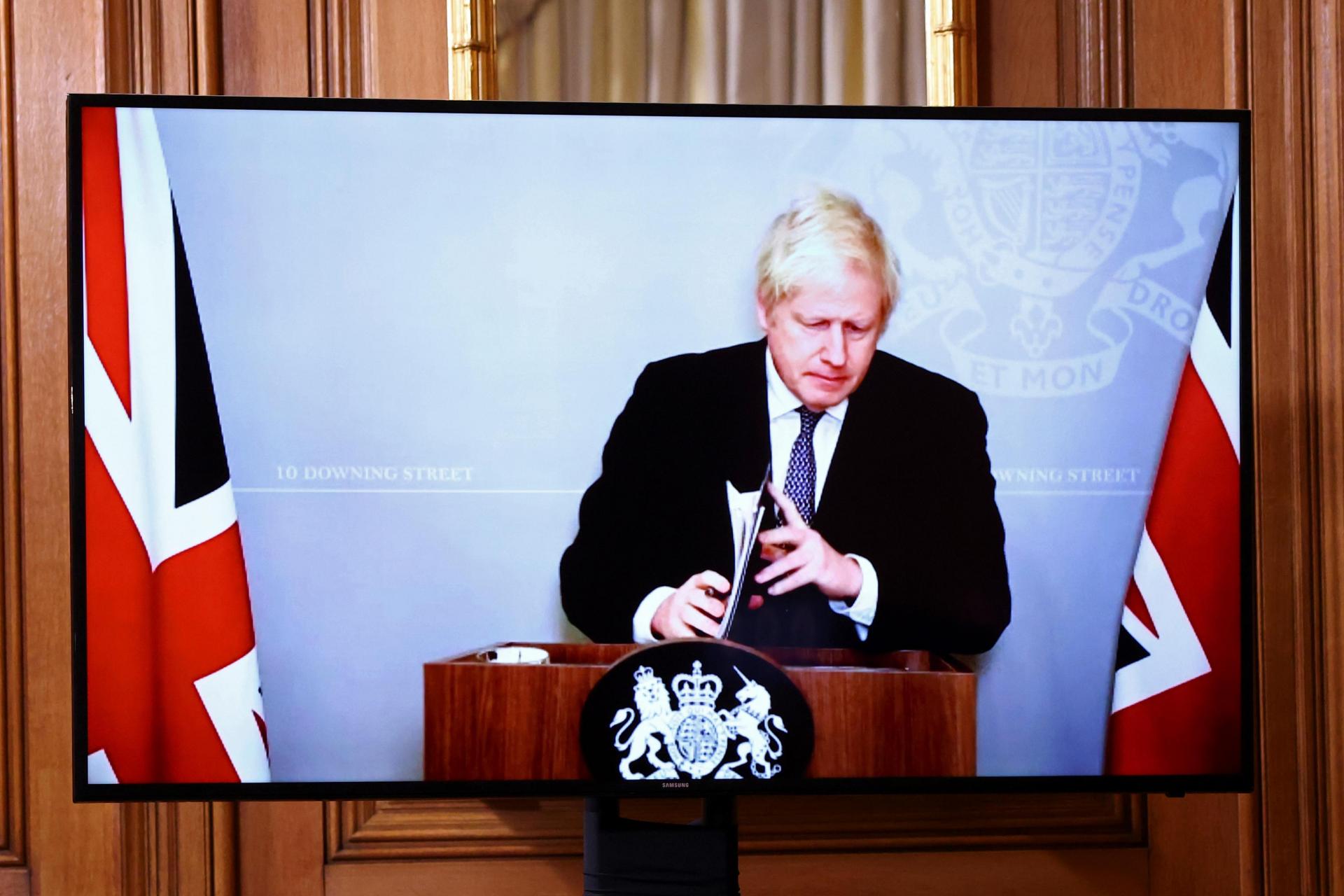 On screen due to self-isolating, Britain&rsquo;s Prime Minister Boris Johnson holds a virtual press conference inside 10 Downing Street in central London on November 23, 2020. Photo: AFP
