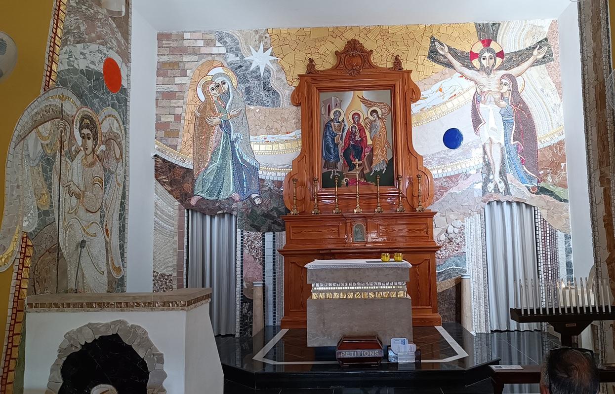 Mosaic scenes around the altar depict episodes of the life of St Anne and Our Lady.