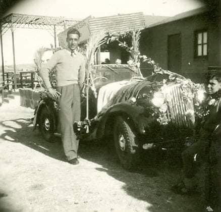 A classic car decorated for the feast.