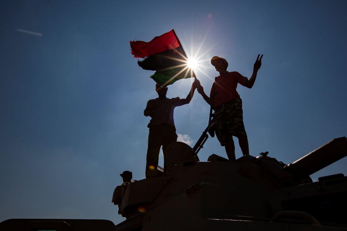 Libyan rebels celebrating on top of a tank outside Brega during the Libyan civil war in 2011.