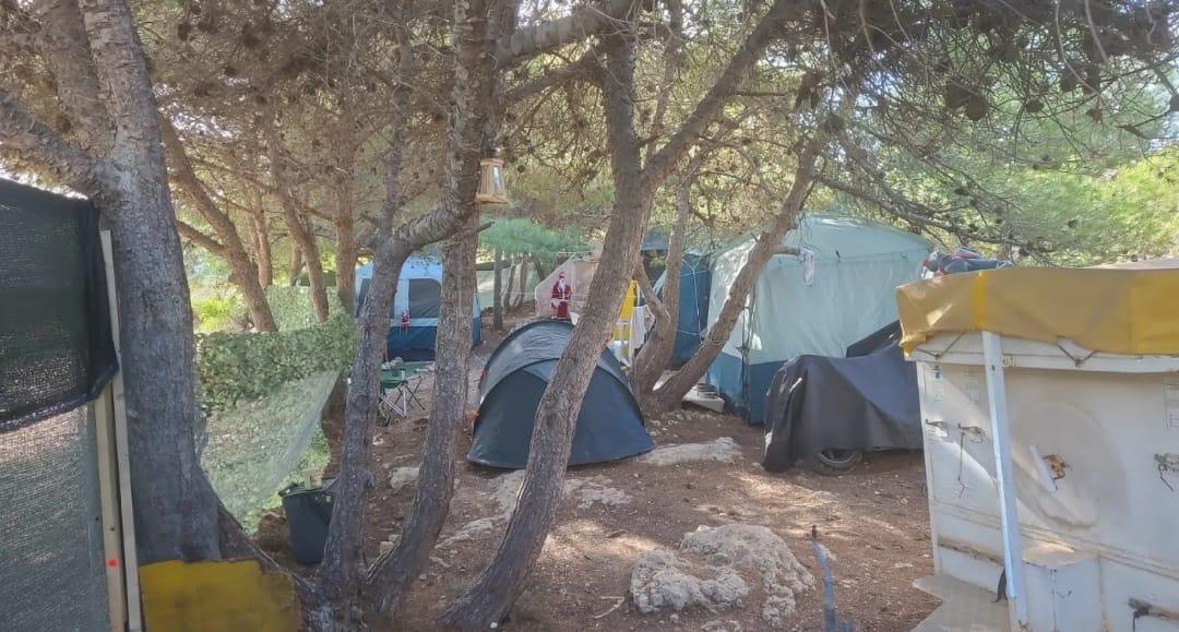 The fenced squatters' camp in Dwejra.