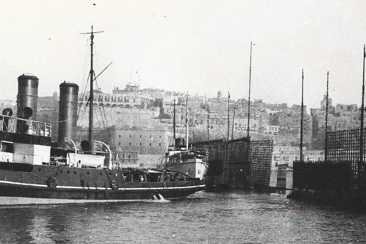 Dockyard tugs and target barges.