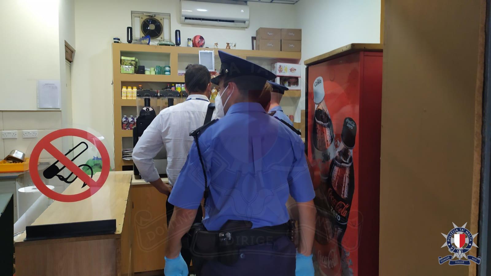 Police and inspectors enter one of the bars. Photo: Police CMRU
