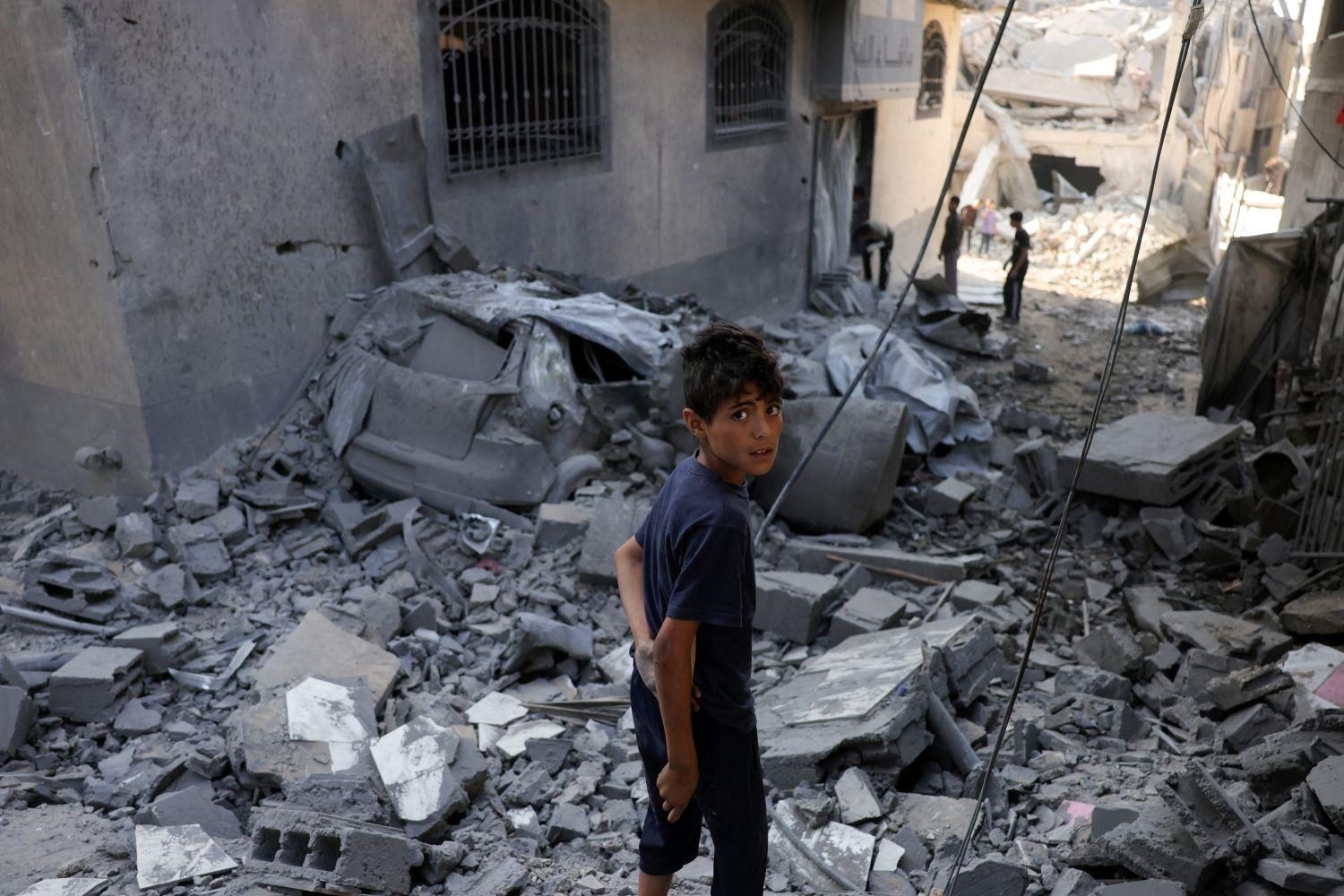 A Palestinian boy stands in the midst of rubble after Israeli bombing destroyed a home in Jabalia's Saftawi neighbourhood in the northern Gaza Strip. Photo: AFP