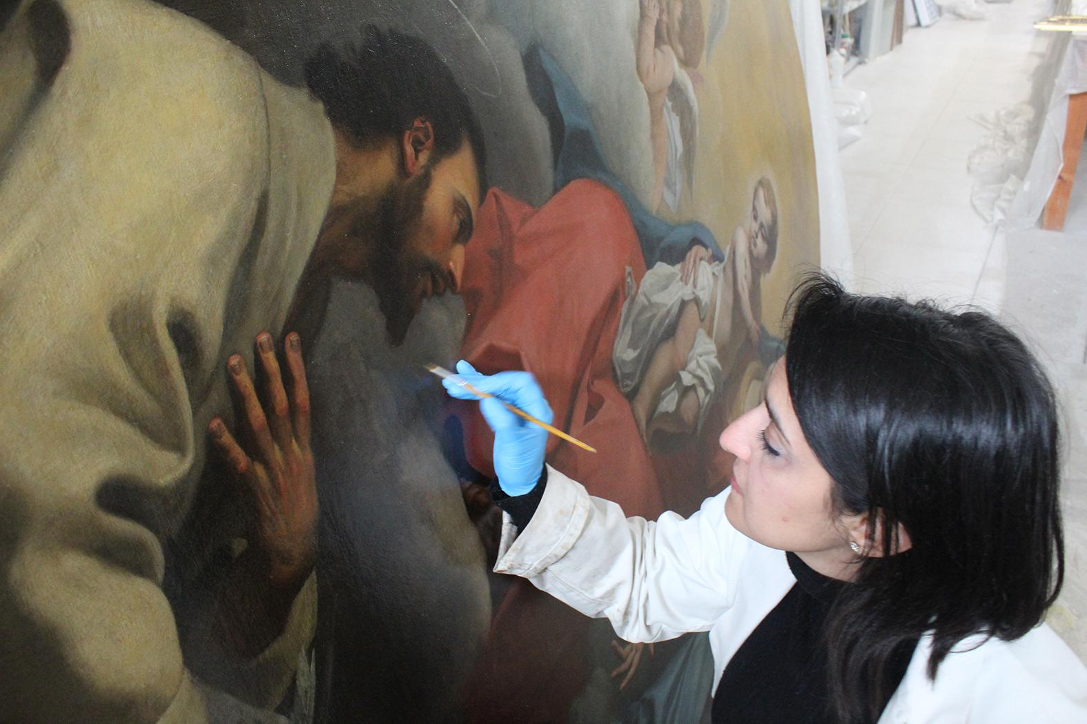 Founder/conservation director Amy Sciberras carrying out chromatic integration of infilled losses using reversible varnish colours. Photo credit: ASC Conservation Centre Ltd.