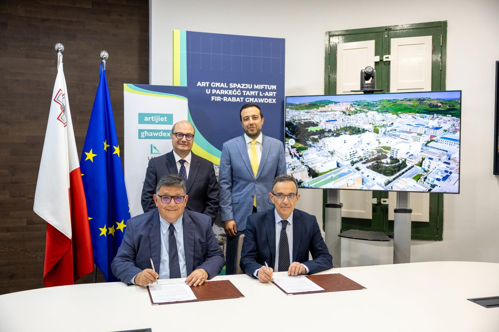 Lands Minister Stefan Zrinzo Azzopardi, alongside Gozo and Planning Minister Clint Camilleri during the land transfer deal. Photo: DOI