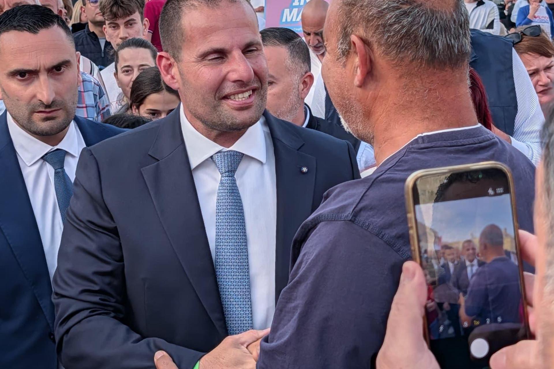 Robert Abela greeting supporters in Siġġiewi's main square before his speech on Tuesday evening. Photo: Chris Sant Fournier
