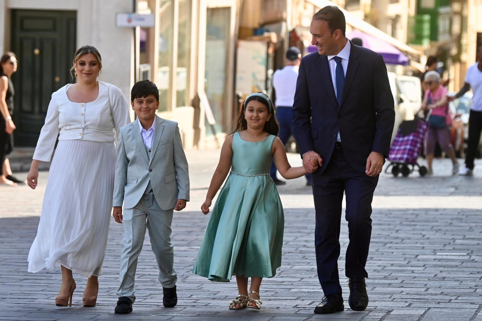 Justice minister Clifton Grima arrives for his swearing-in ceremony with his family. Photo: Jonathan Borg