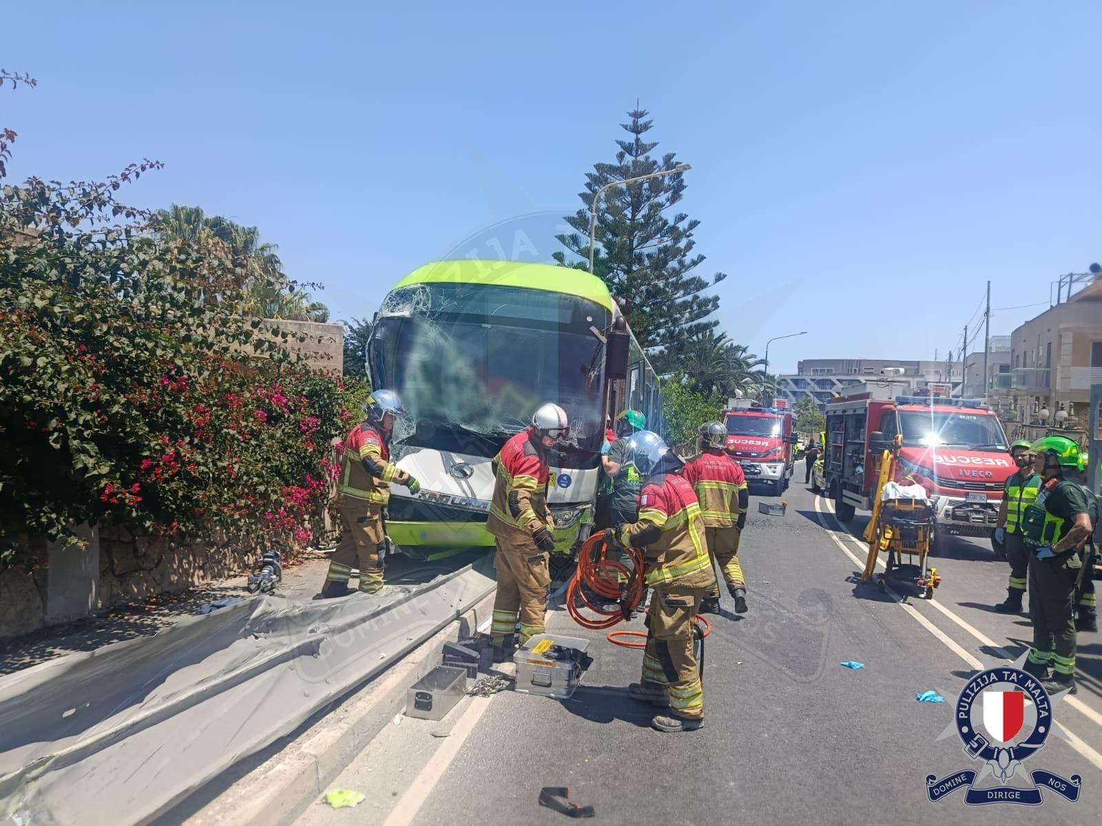 Upon impact, the bus rolled backwards onto the pavement crashing into the metal barrier and stopping just outside a residence. Photo: Malta Police Force