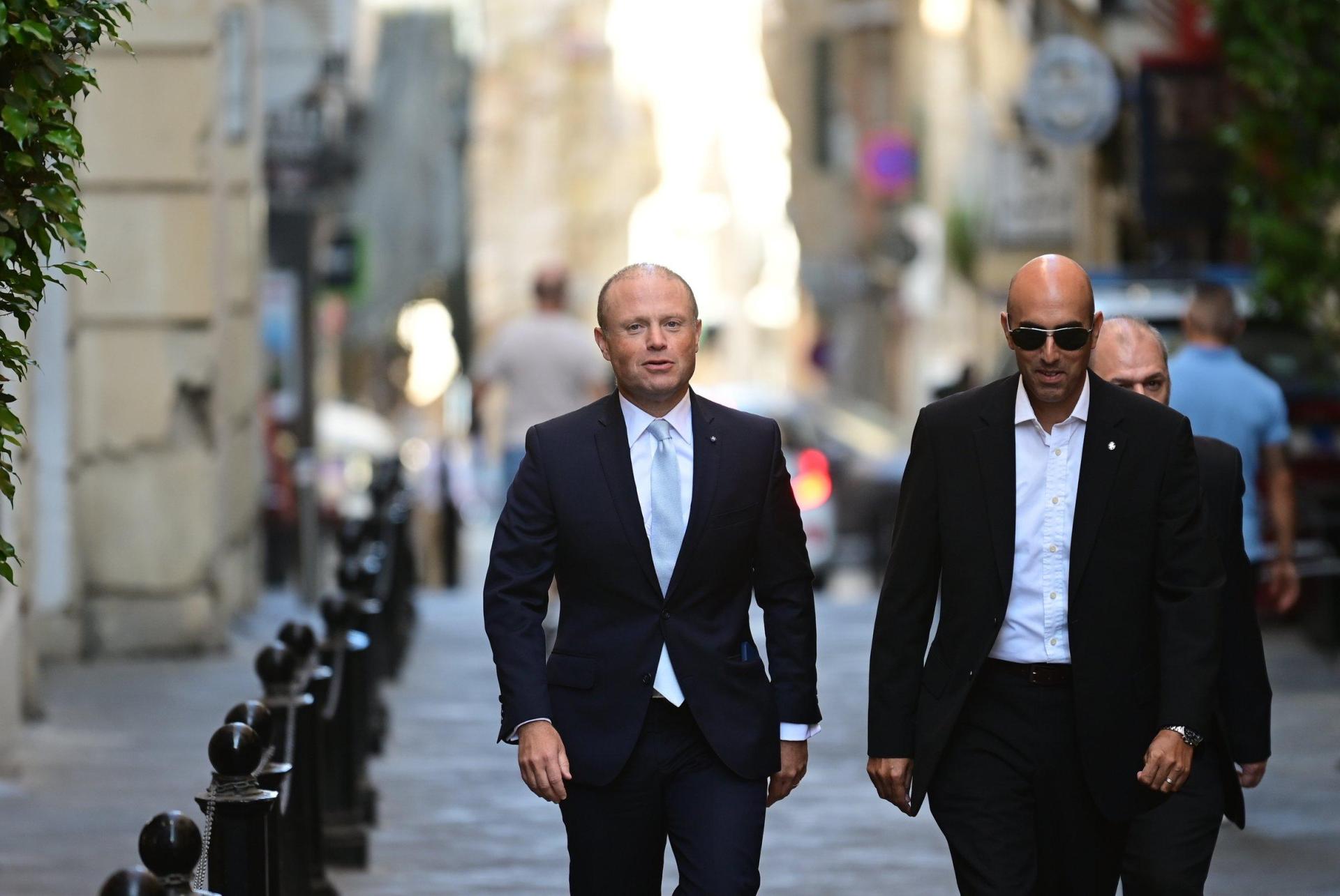 Joseph Muscat (left) attending court for a separate case. File photo