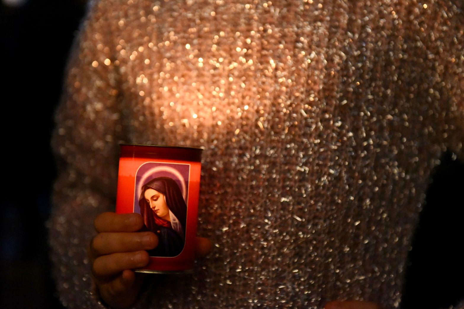 A woman holding a picture of Our Lady at the protest. Photo: Chris Sant Fournie