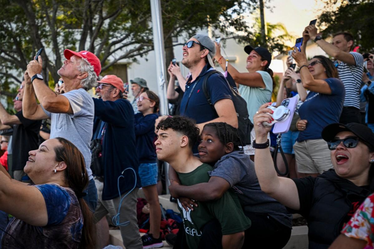 We're going to the moon! Space enthusiasts at a park in Titusville. Photo: AFP