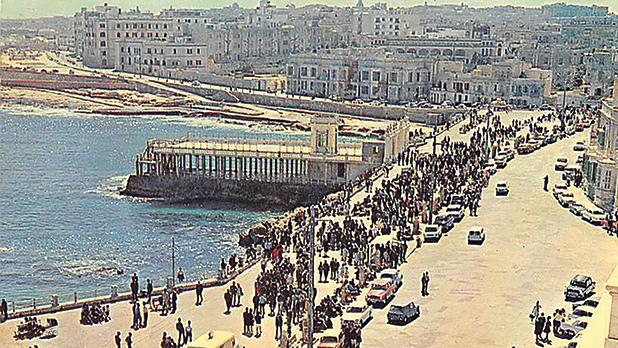 Families enjoy a stroll in the sunshine along the promenade next to the Chalet in Sliema in the early 1960s. Photo: Bay Retro