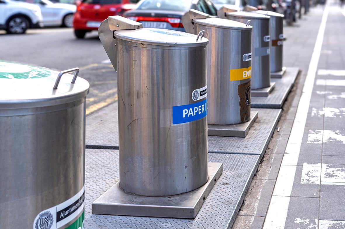 A row of modern stainless steel pneumatic waste collection bins on a street in Barcelona. Photo: Shutterstock.com