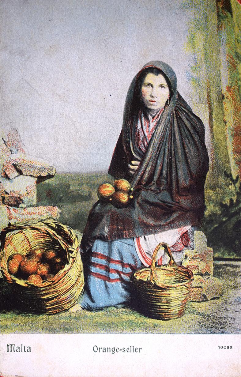 A 1900s coloured postcard of an orange seller