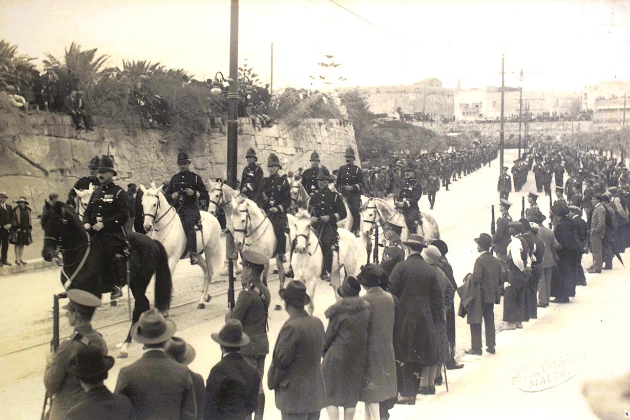 Mounted servicemen escort the governor&rsquo;s remains. Postcard by Salvatore Lorenzo Cassar.