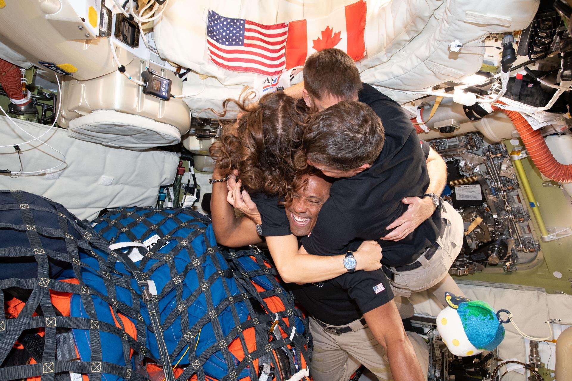 The Artemis II crew &ndash; (clockwise from left) Mission Specialist Christina Koch, Mission Specialist Jeremy Hansen, Commander Reid Wiseman, and Pilot Victor Glover &ndash; take time out for a group hug inside the Orion spacecraft on their way home. Photo: NASA