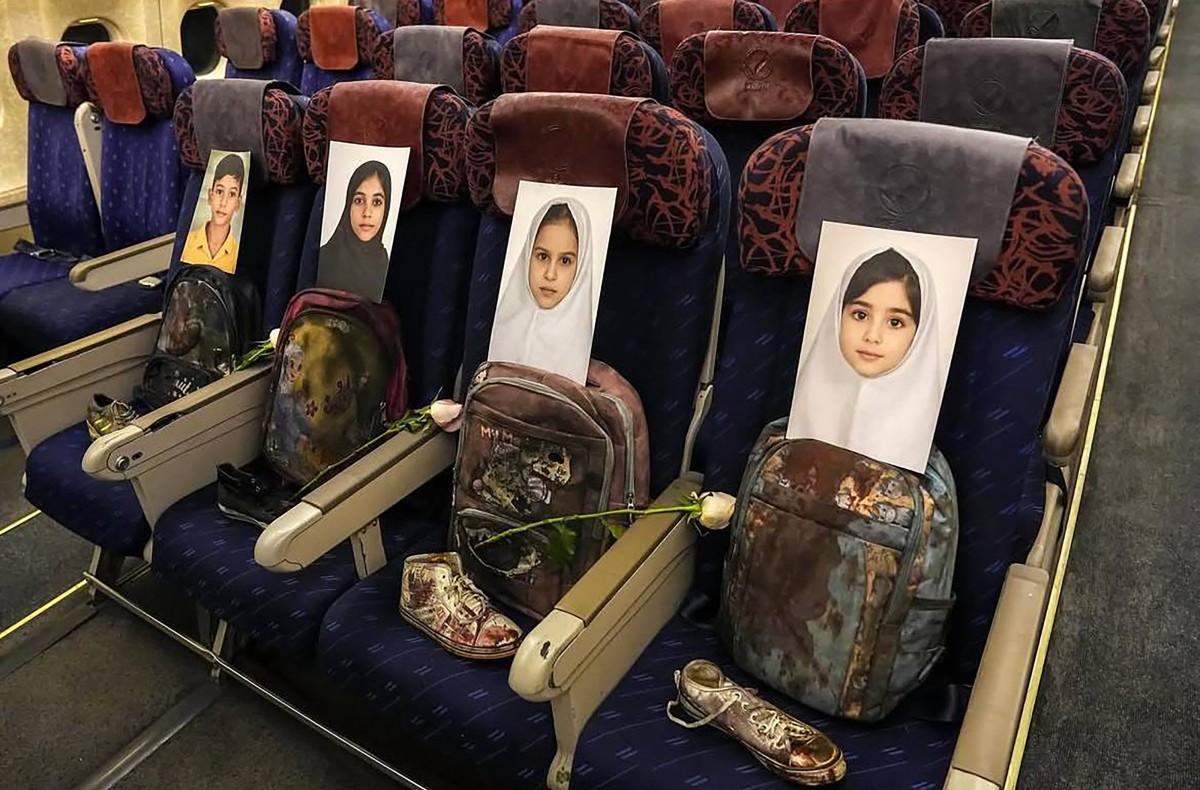 Photos and belongings of the children killed in Madrasa Minab in Iran, placed inside the plane carrying Iran's Foreign Minister Abbas Araghchi and parliamentary speaker Mohammad Bagher Ghalibaf to Pakistan for talks with the United States. Photo: AFP