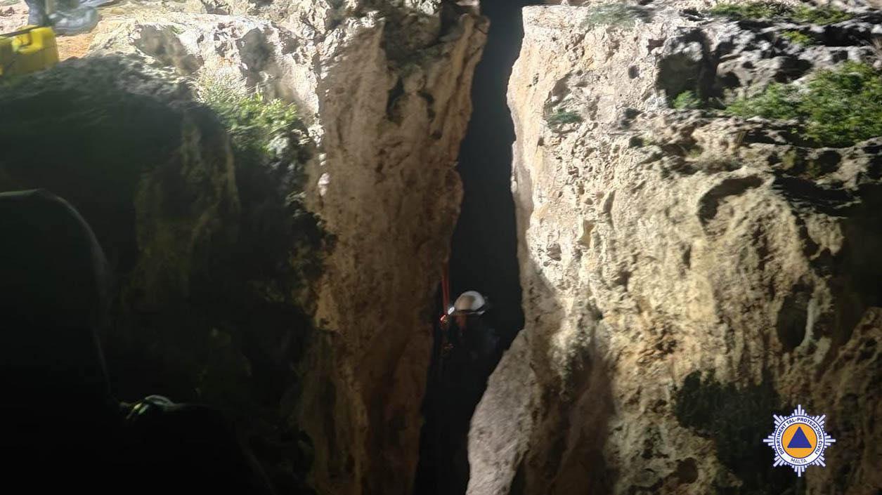 A rescuer abseils to the scene of the incident. Photo: CPD.