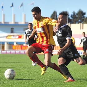 Birkirkara&rsquo;s Edward Herrera holds off Hibs striker Luis Edison. Photo: Chris Sant Fournier