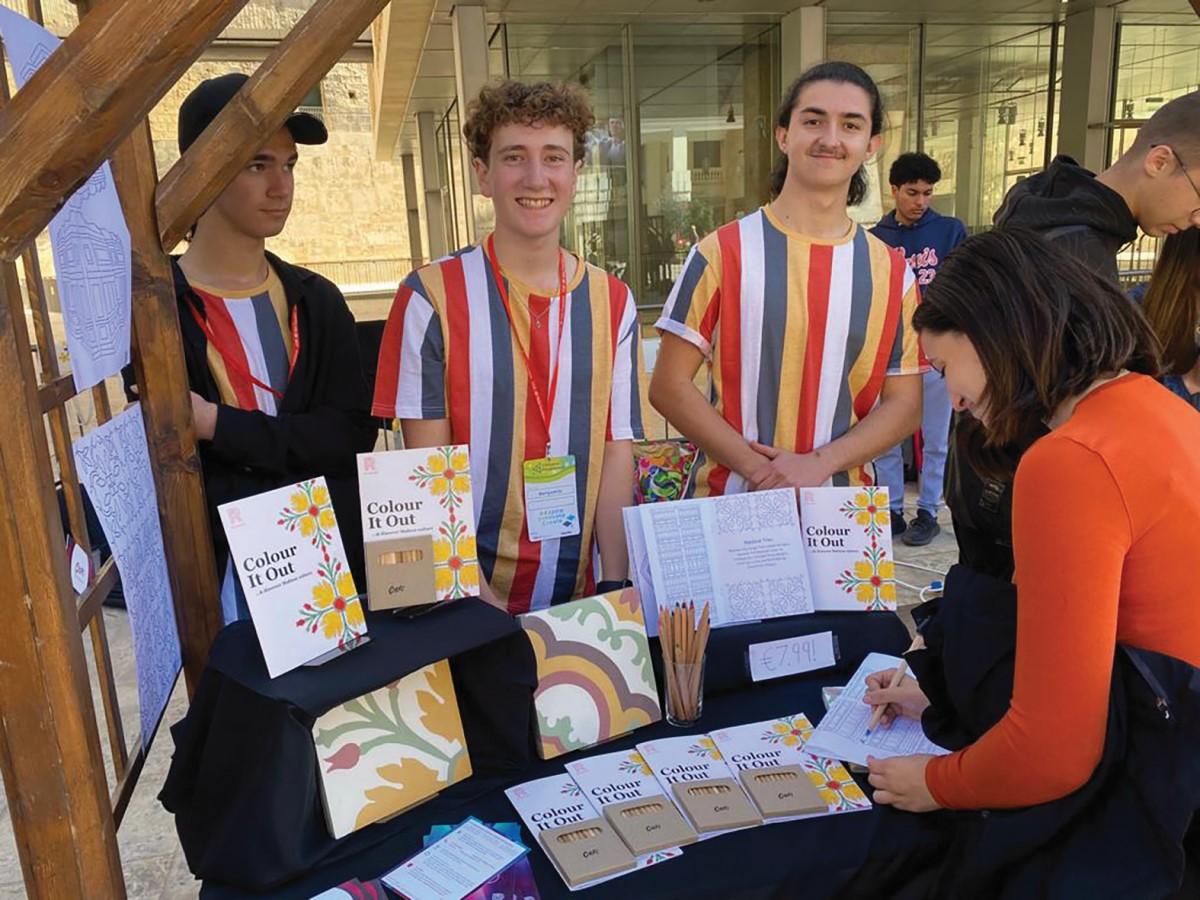 The JA Malta Colori team manning a stand promoting its mindfulness colouring book. Roman is seen on the left.