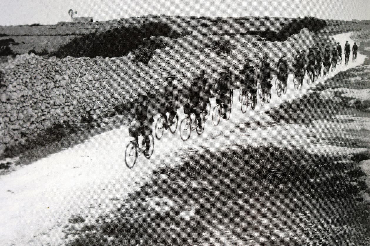 WWII army cyclists in the Maltese countryside.