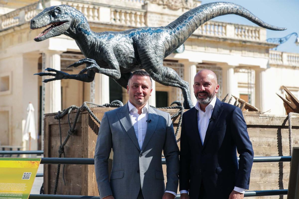 Tourism Minister Clayton Bartolo (left) and Film Commissioner Johann Grech posing with a statue of a dinosaur in Valletta as part of last year's promotion of the film 'Jurassic World'. Photo: DOI - Omar Camilleri