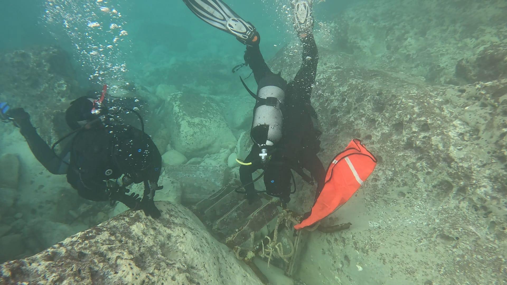 Divers recovering a ladder and other debris in the aftermath of Storm Harry. Photo: Coast is Clear