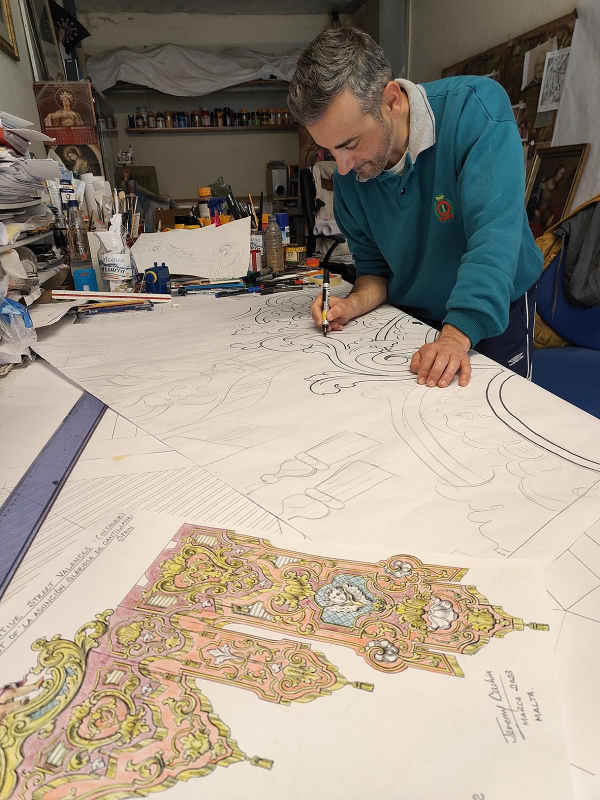 Jeremy Cachia working on the design of the banners.