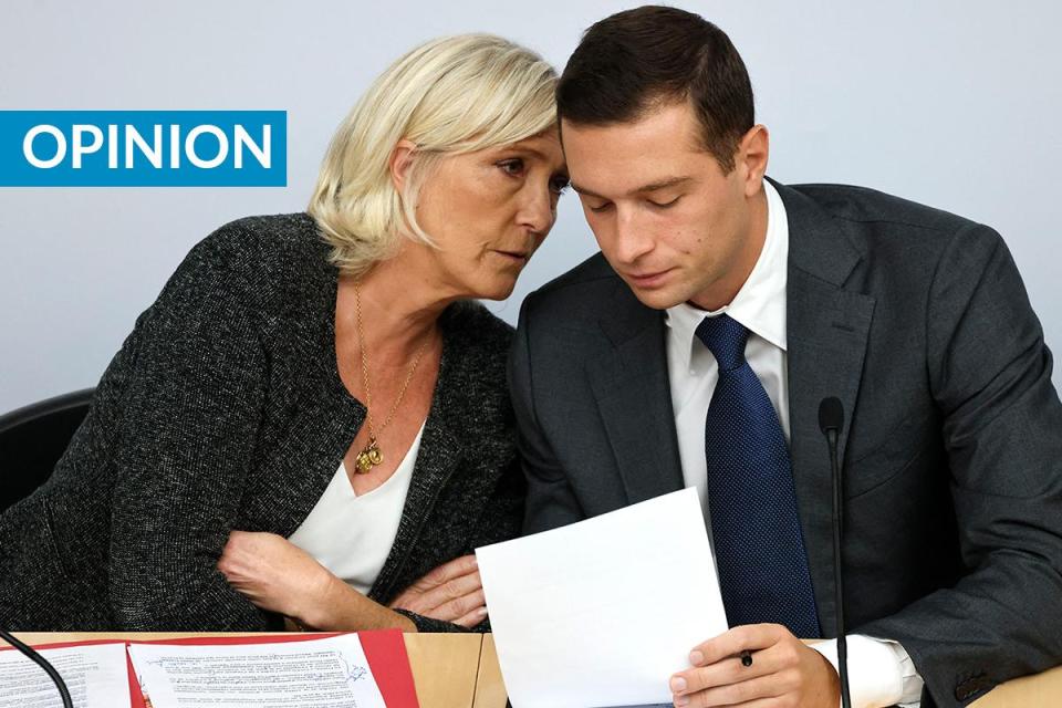 Rassemblement National parliamentary group president Marine Le Pen speaks to Rassemblement National president Jordan Bardella. File photo: AFP