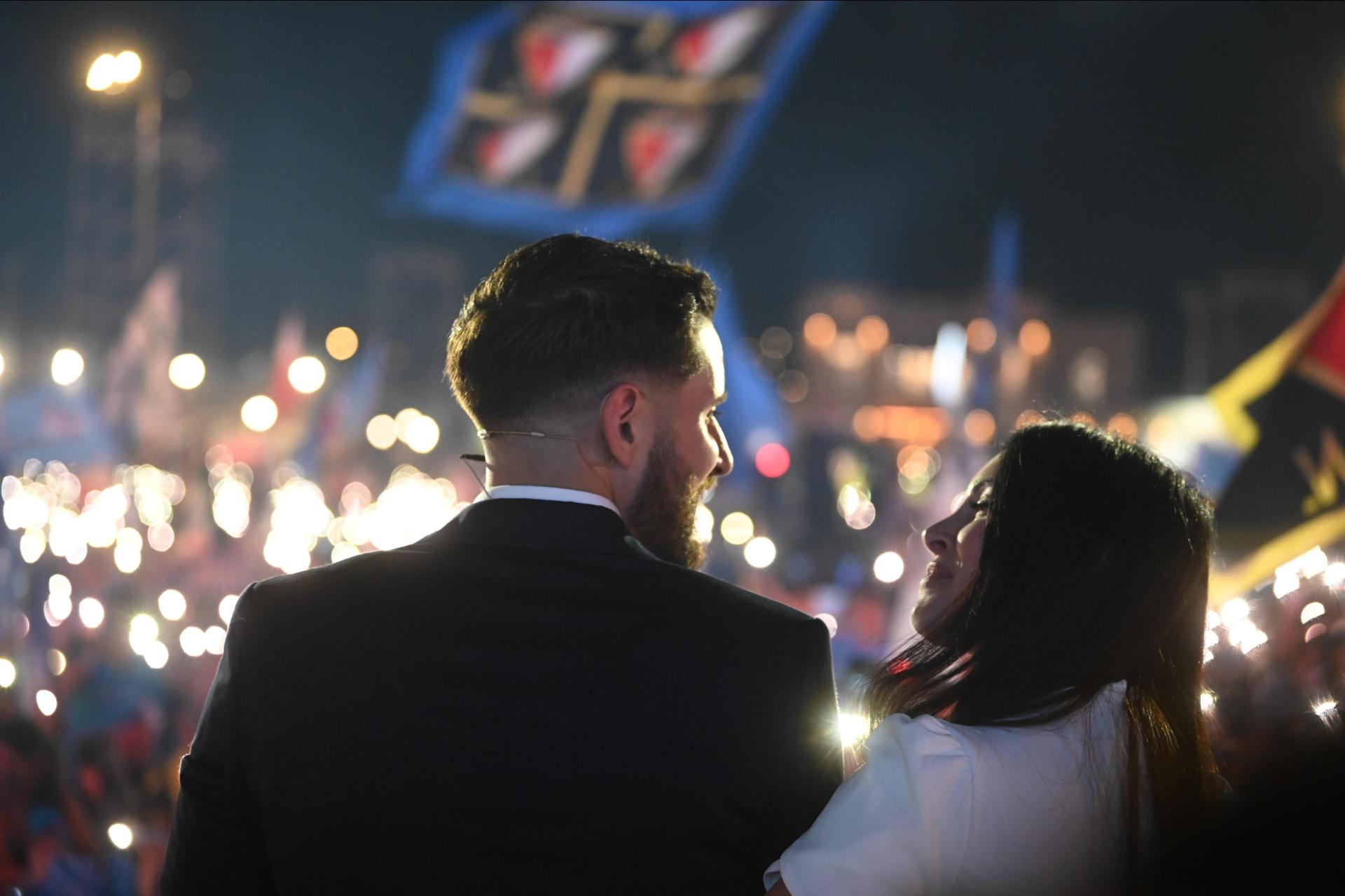 PN leader Alex Borg and his partner Sarah Bajada share a moment during the party's final mass meeting at the end of the election campaign. Photo: Jonathan Borg