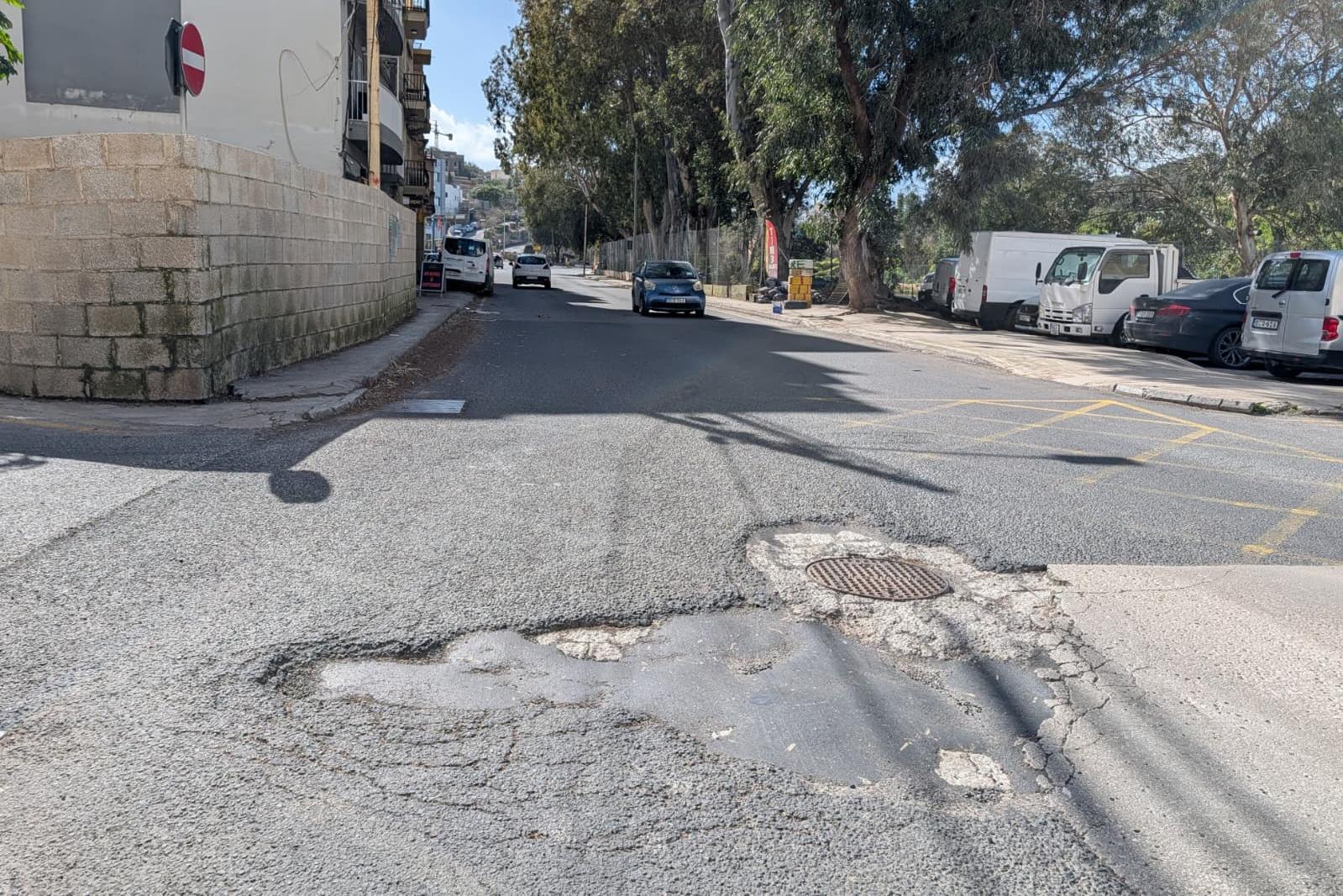 The pothole is patched up but never properly mended, according to a resident. Photo: Chris Sant Fournier