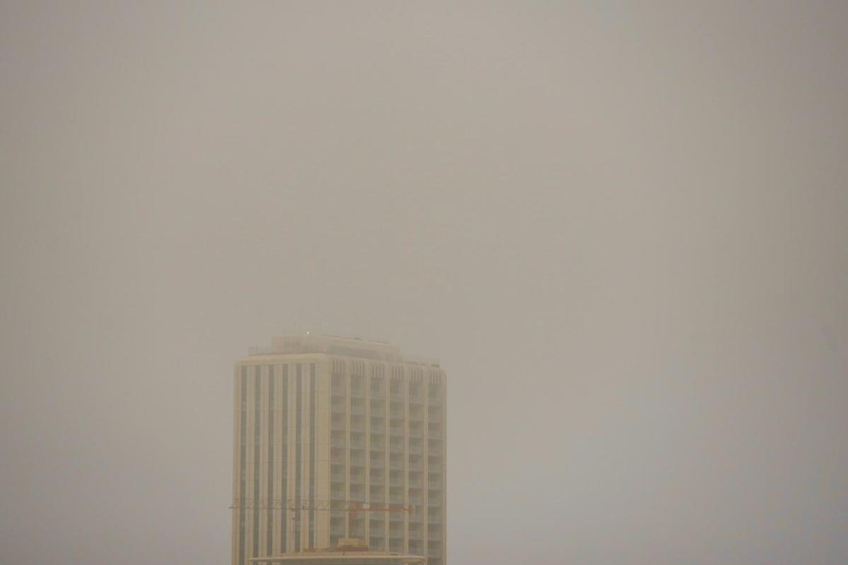 Hazy air engulfs Mercury Towers as Saharan dust is expected to linger for the rest of the week. Photo: Chris Sant Fournier