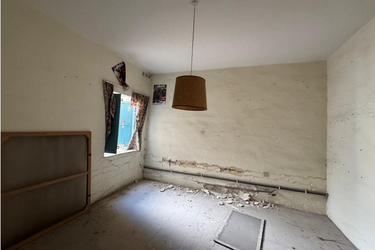 A room on the ground floor of the block before the collapse