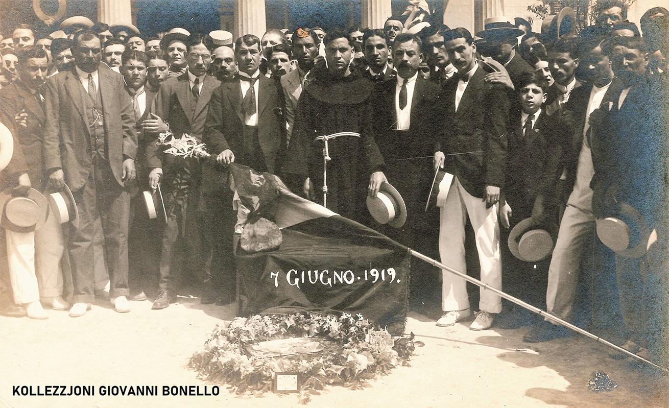 This photo, taken the day after Sette Giugno, shows the sombre mood of the mourners gathered in St George&rsquo;s Square. The bloodstained cap of one of the victims, Lorenzo Dyer, was placed on the Maltese flag. Photo: Giovanni Bonello Collection