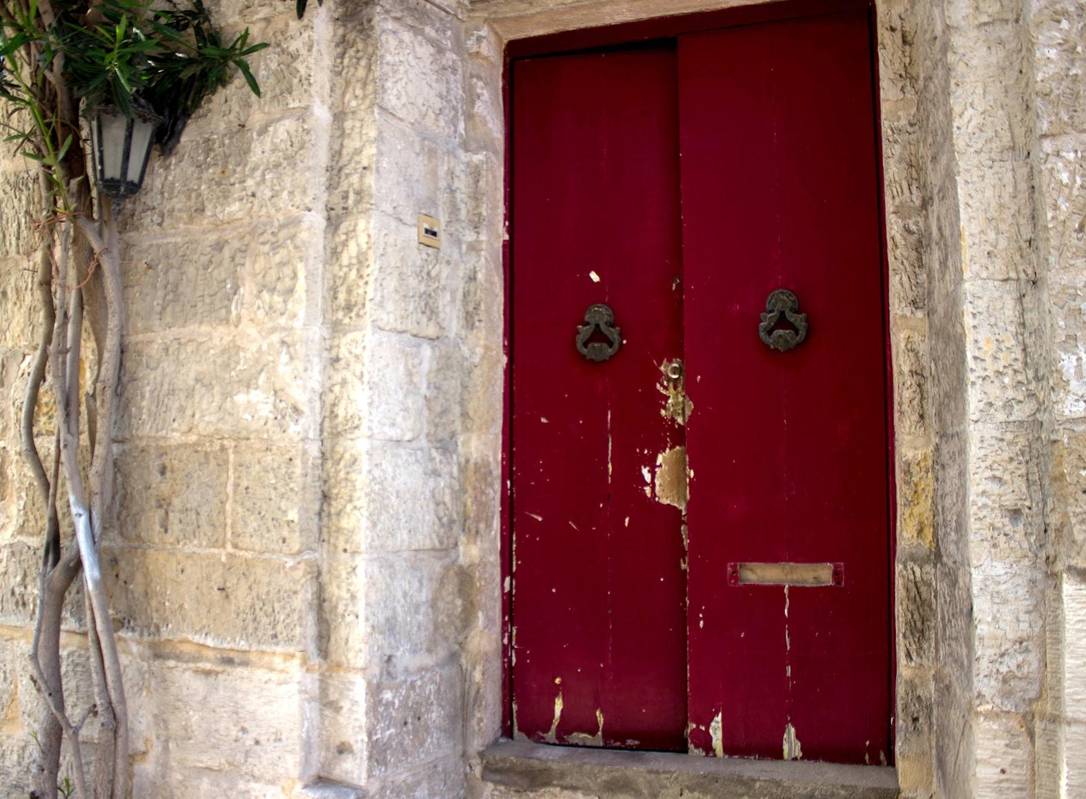 The house with the closed door sadly stands in a state of sheer abandon, but what happened in it still lives. Photo: Shutterstock.com