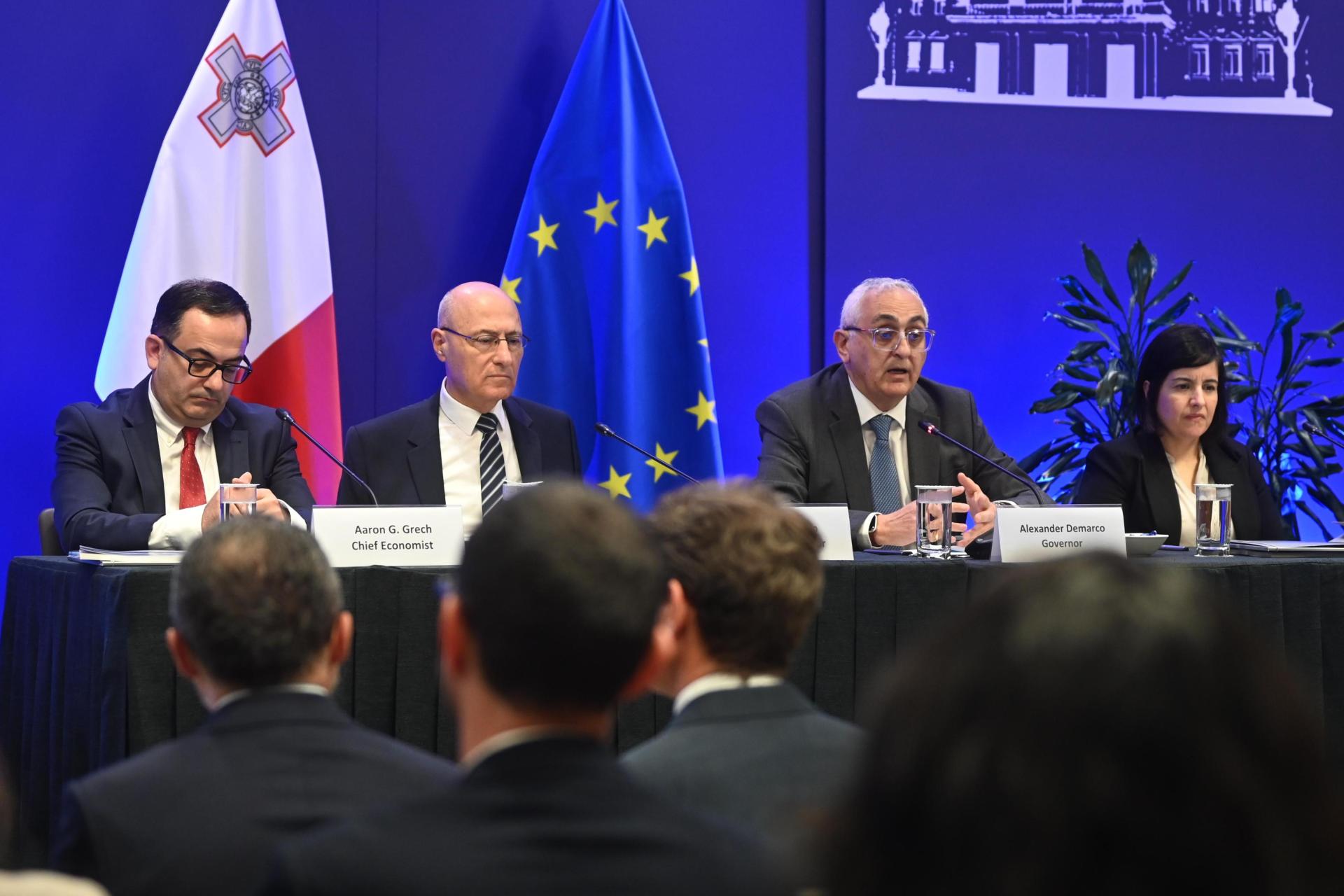 Central Bank governor Alexander Demarco presenting the bank's annual report alongside other officials. Photo: Jonathan Borg.