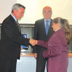 Jeffrey Pullicino Orlando (left) and Francis Stivala of NSTF presenting a book to one of the winners.