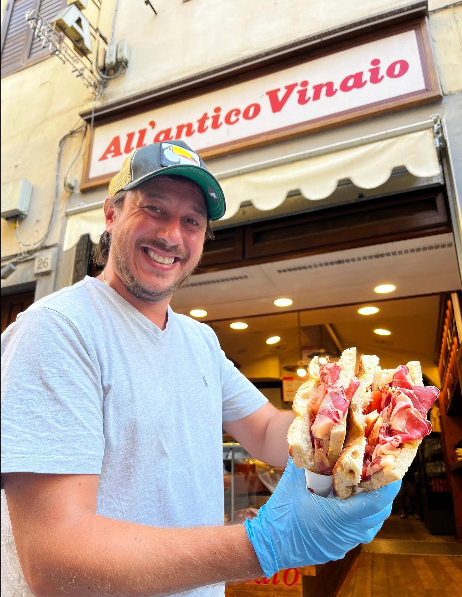 Tommy Mazzanti holding a sandwich in front of the shop. Photo: All&rsquo;Antico Vinaio
