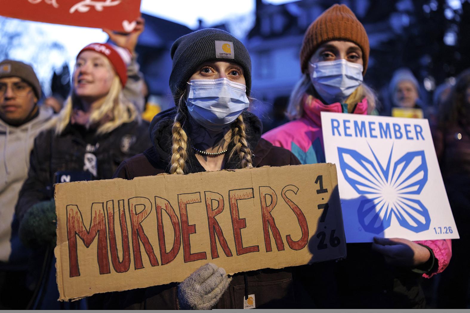 People attend a vigil at the site where a woman was shot and killed by an immigration officer in Minneapolis, Minnesota on Wednesday. Photo: AFP