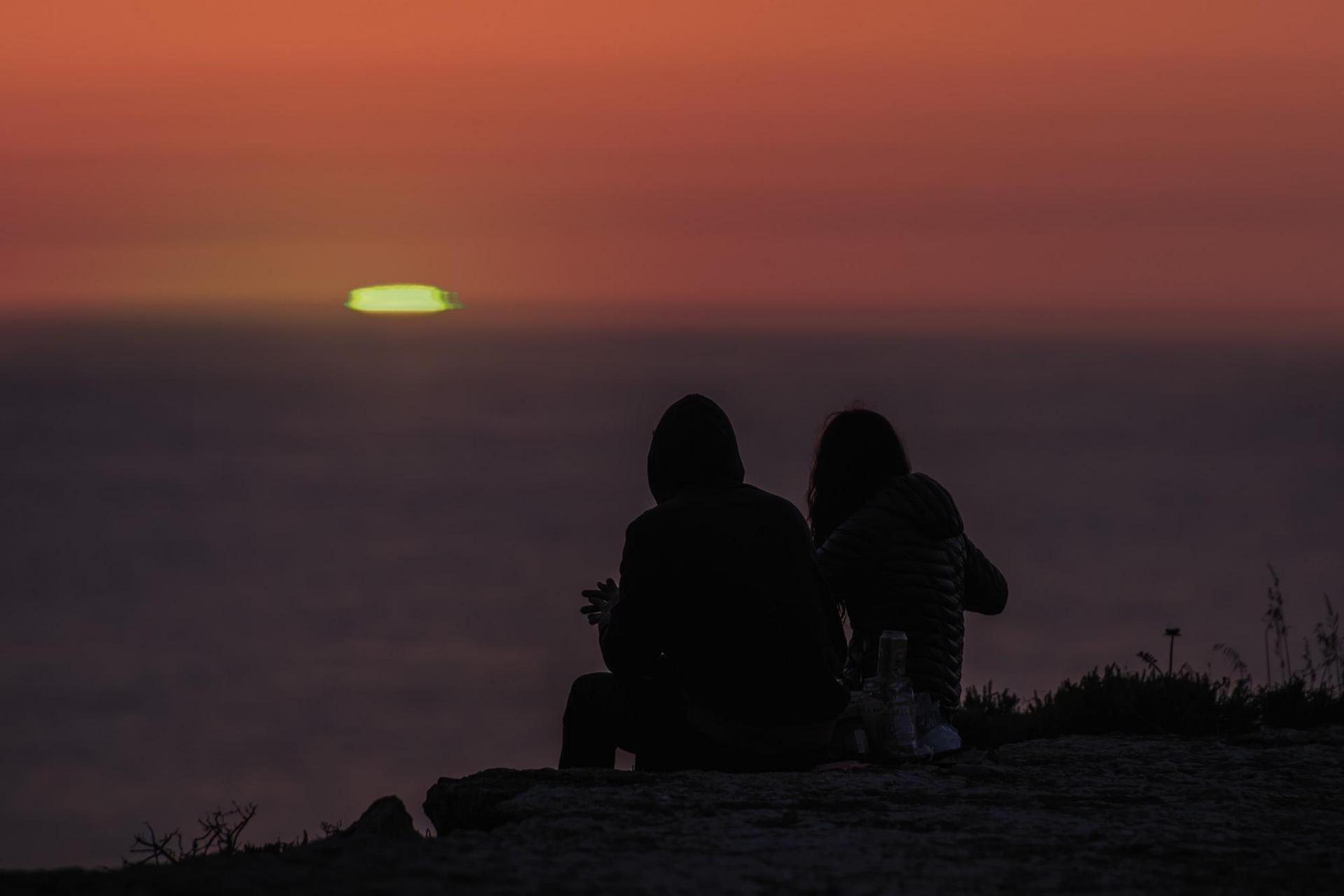 A rare green flash sunset surprises Rita and Joseph as they sit down for an impromptu romantic picnic on the San Dimitri cliffs, the westernmost point of Gozo.