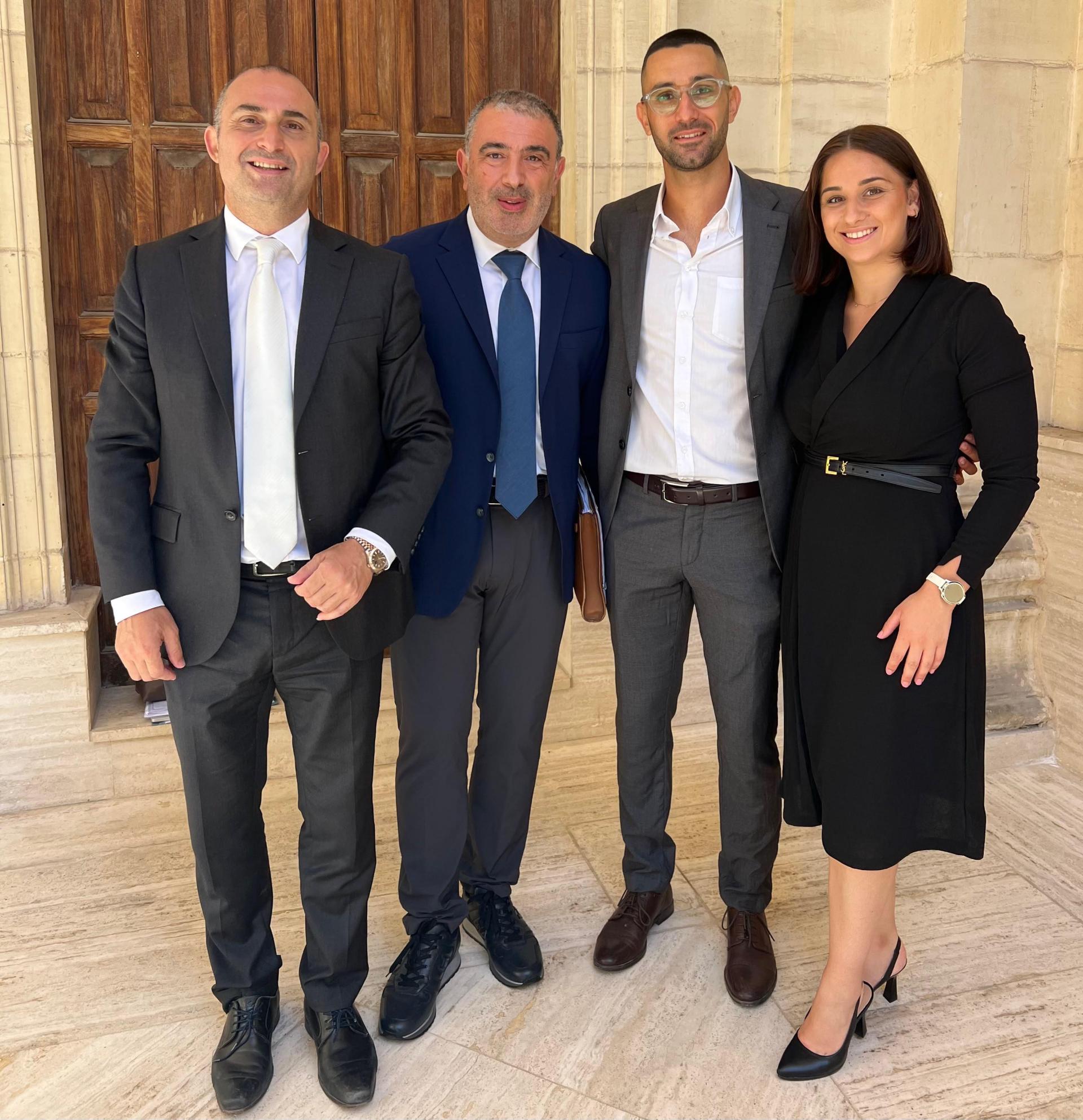 Pisani (second from right) with his lawyers Franco Debono, Edward Gatt and Adreana Zammit.