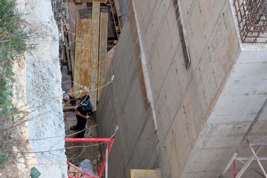 A policeman inspects the spot where the fall happened. Photo Chris Sant Fournier.