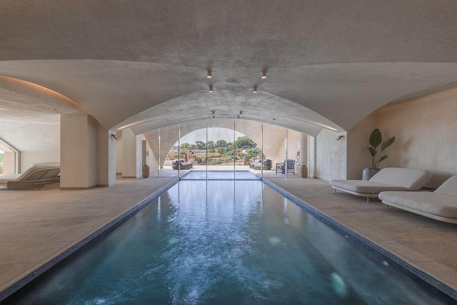 The indoor pool and outdoor jacuzzi