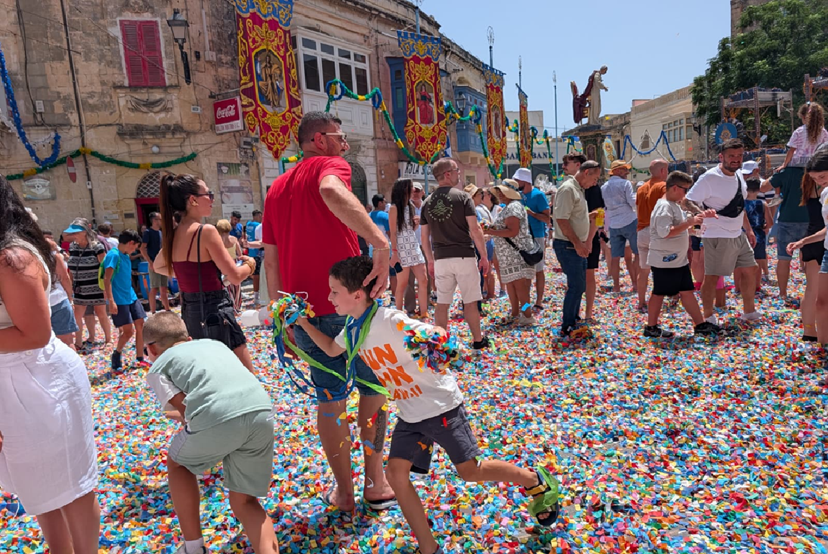 The celebrations aren't over yet! Children playing with confetti following the 20-minute daytime show. Photo: Chris Sant Fournier