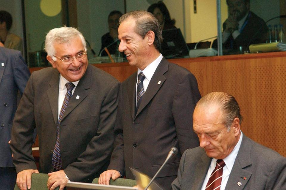 Dalli says his acrimonious relationship with former PM Lawrence Gonzi (centre) forced him to seek opportunities overseas. Photo: AFP.