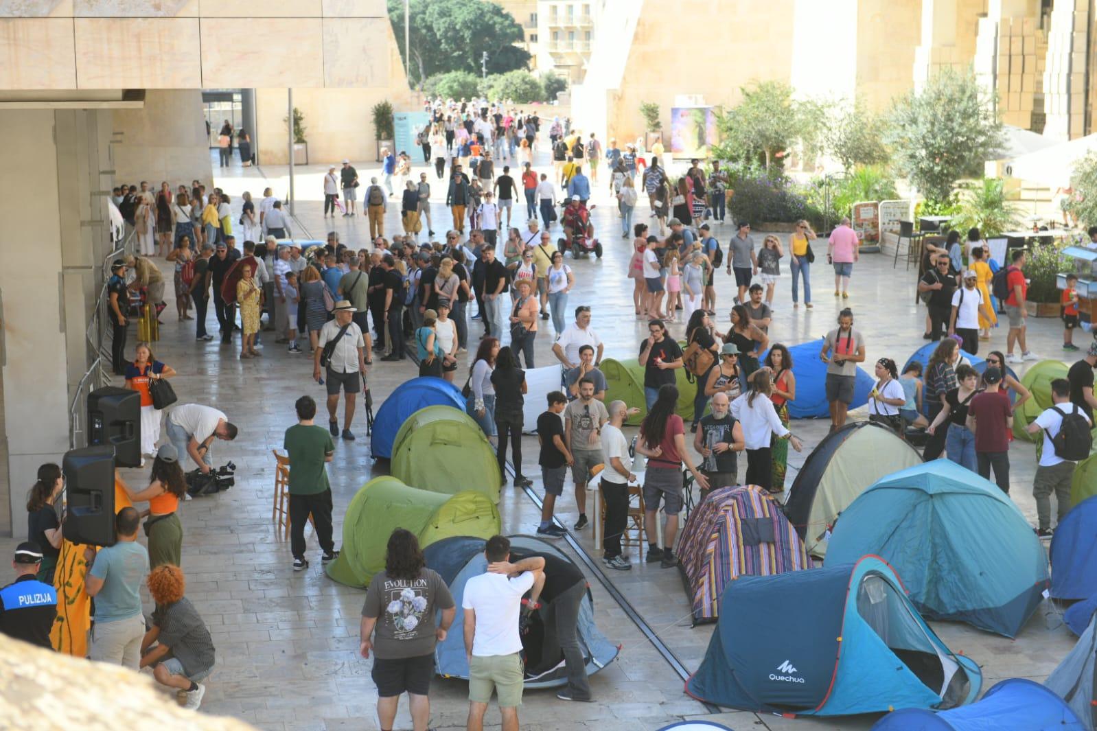 Some pedestrians stopped by to ask about the protest. Photo: Matthew Mirabelli
