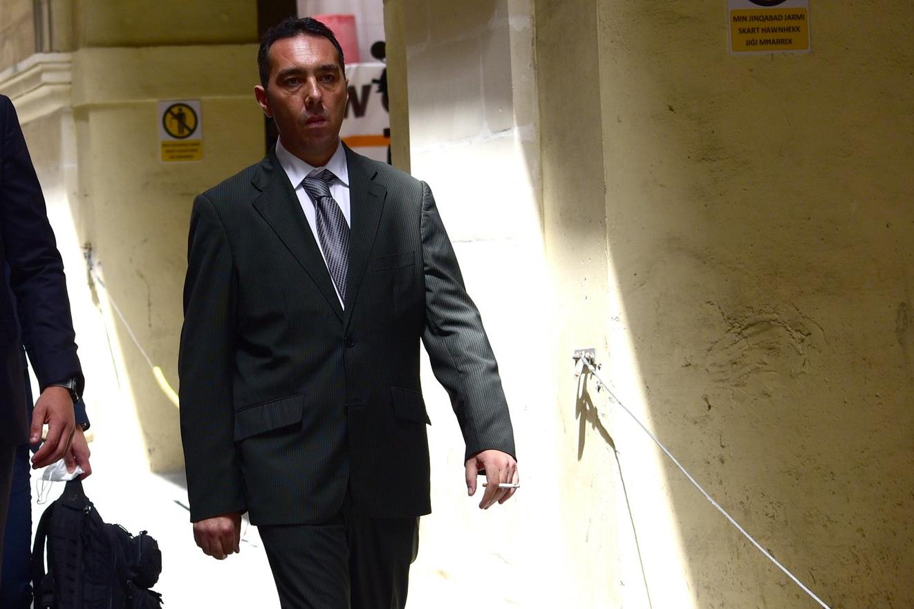 Melvin Theuma walking outside court.