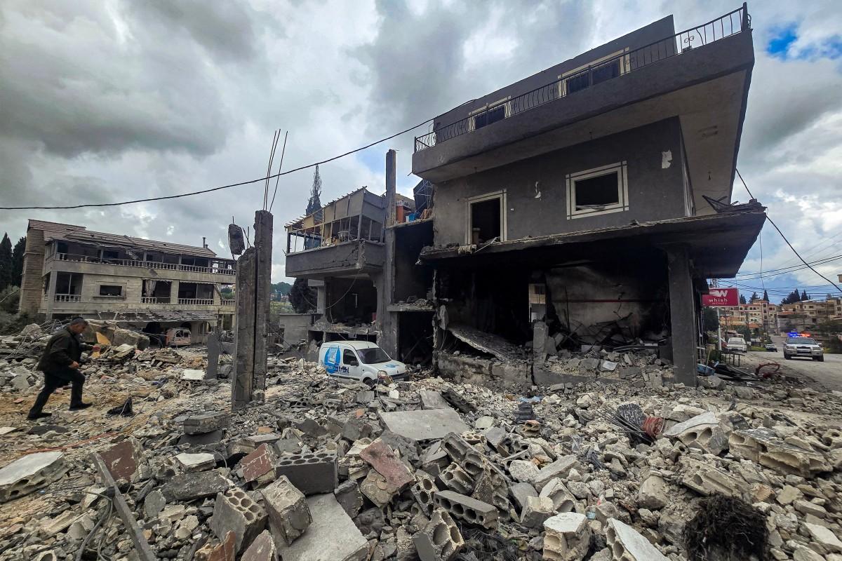 People inspect destruction following overnight Israeli bombardment on the village of Maarake in southern Lebanon on Tuesday. Photo: AFP