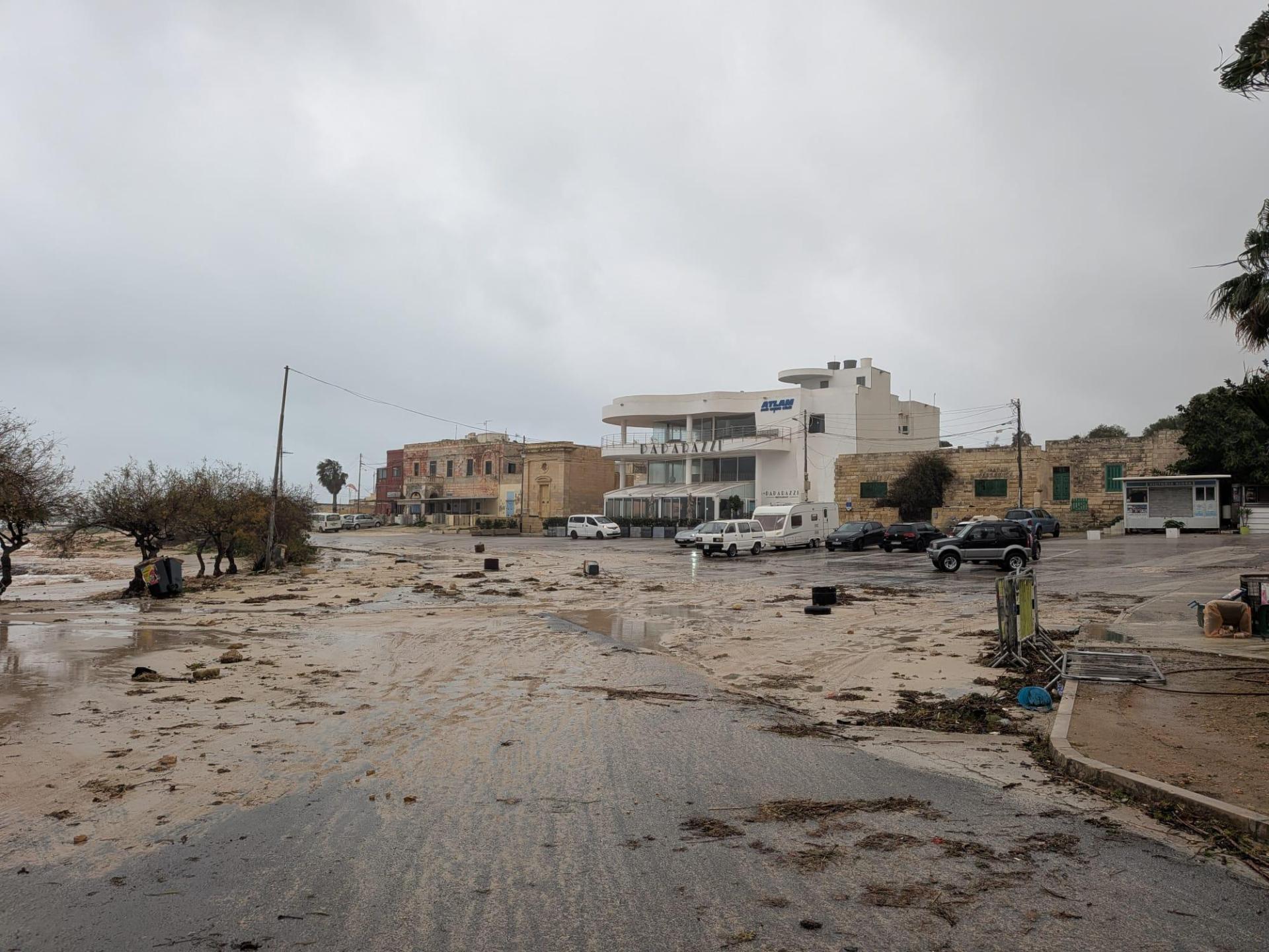 Sand and debris cover a car park in Baħar Iċ-Ċaħaq on Tuesday afternoon. Photo: Burak Manap